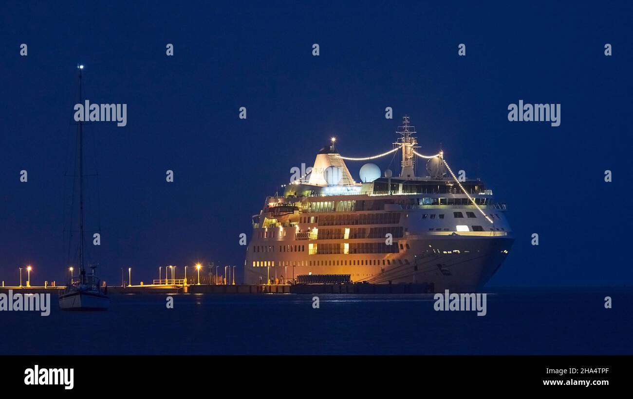 greece,greek islands,ionian islands,kefalonia,argostoli,capital of kefalonia,ferry port of argostoli,large cruise ship is at anchor,evening shot,night blue sky Stock Photo