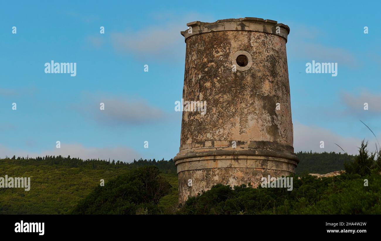 greece,greek islands,ionian islands,kefalonia,fiskardo,morning mood,partly cloudy sky,round tower,blue morning sky with isolated white clouds Stock Photo