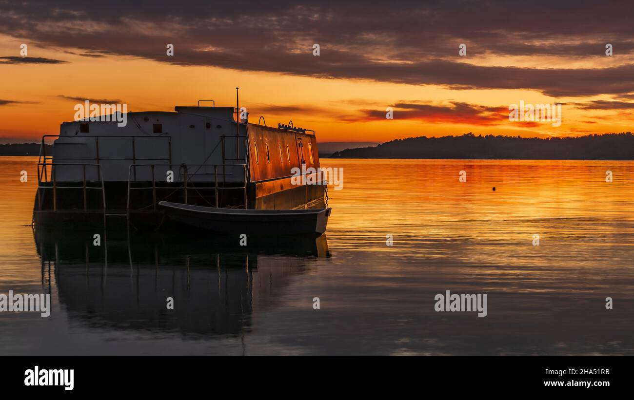 Old boat on the sea on the sunset Stock Photo - Alamy