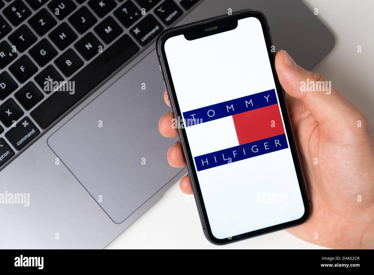 Tommy Hilfiger application logo for online shopping on the screen of mobile  phone. Man hand holding a smartphone with application. November 2021, San  Francisco, USA Stock Photo - Alamy