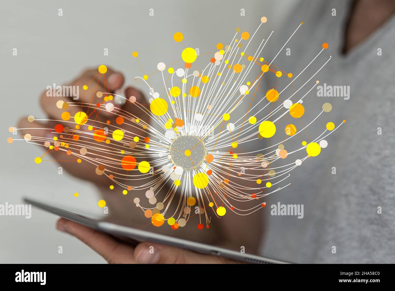 Dots and lines projecting from a man's tablet - networking and diffusion of innovation concept Stock Photo