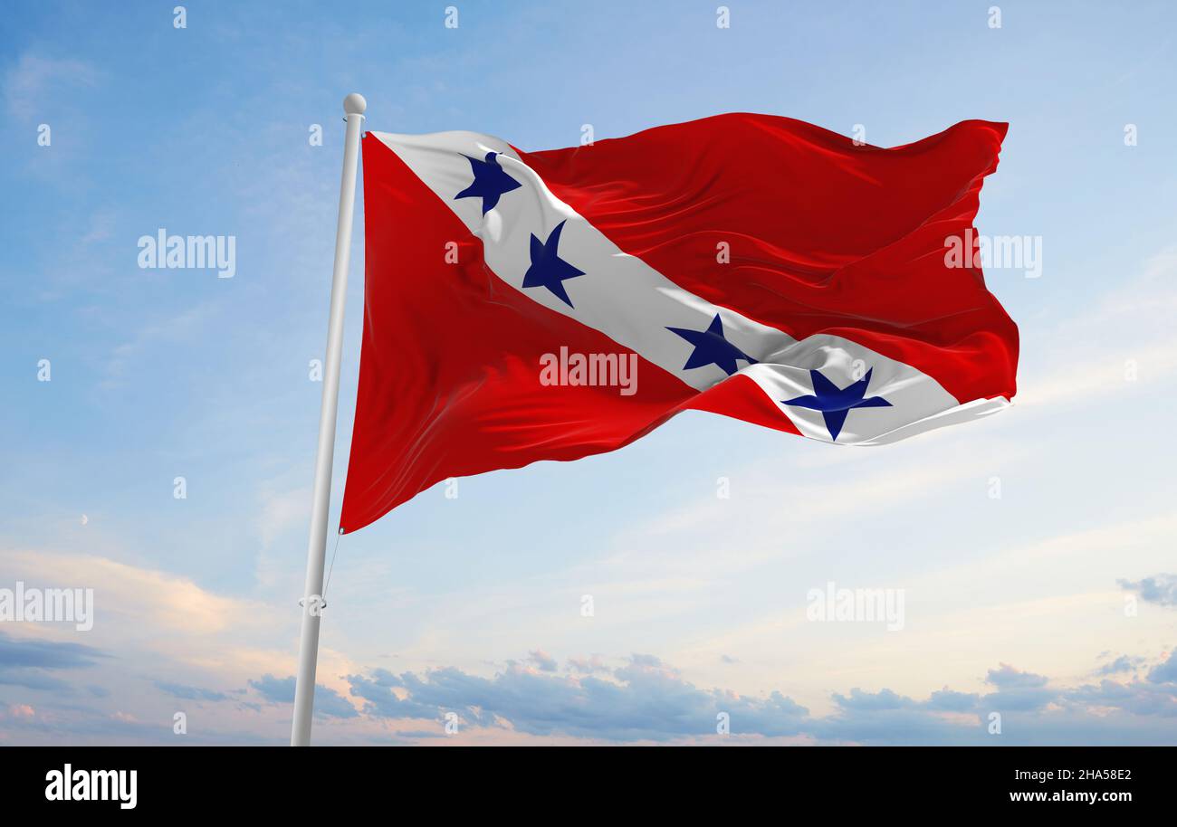 flag of Marica , Brazil at cloudy sky background on sunset, panoramic view. Brazilian travel and patriot concept. copy space for wide banner. 3d illus Stock Photo