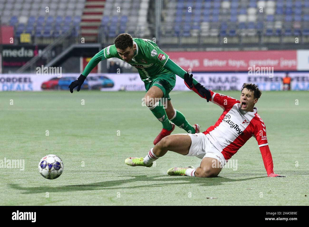 EMMEN, NETHERLANDS - DECEMBER 10: Jasin Assehnoun of FC Emmen, Mauro  Savastano of FC Dordrecht during the Dutch Keukenkampioendivisie match  between FC Emmen and FC Dordrecht at De Oude Meerdijk on December