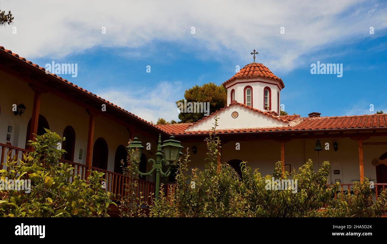 greece,greek islands,ionian islands,lefakada or lefkas,faneromeni monastery,view from the inner courtyard up to the residential buildings and the church dome Stock Photo