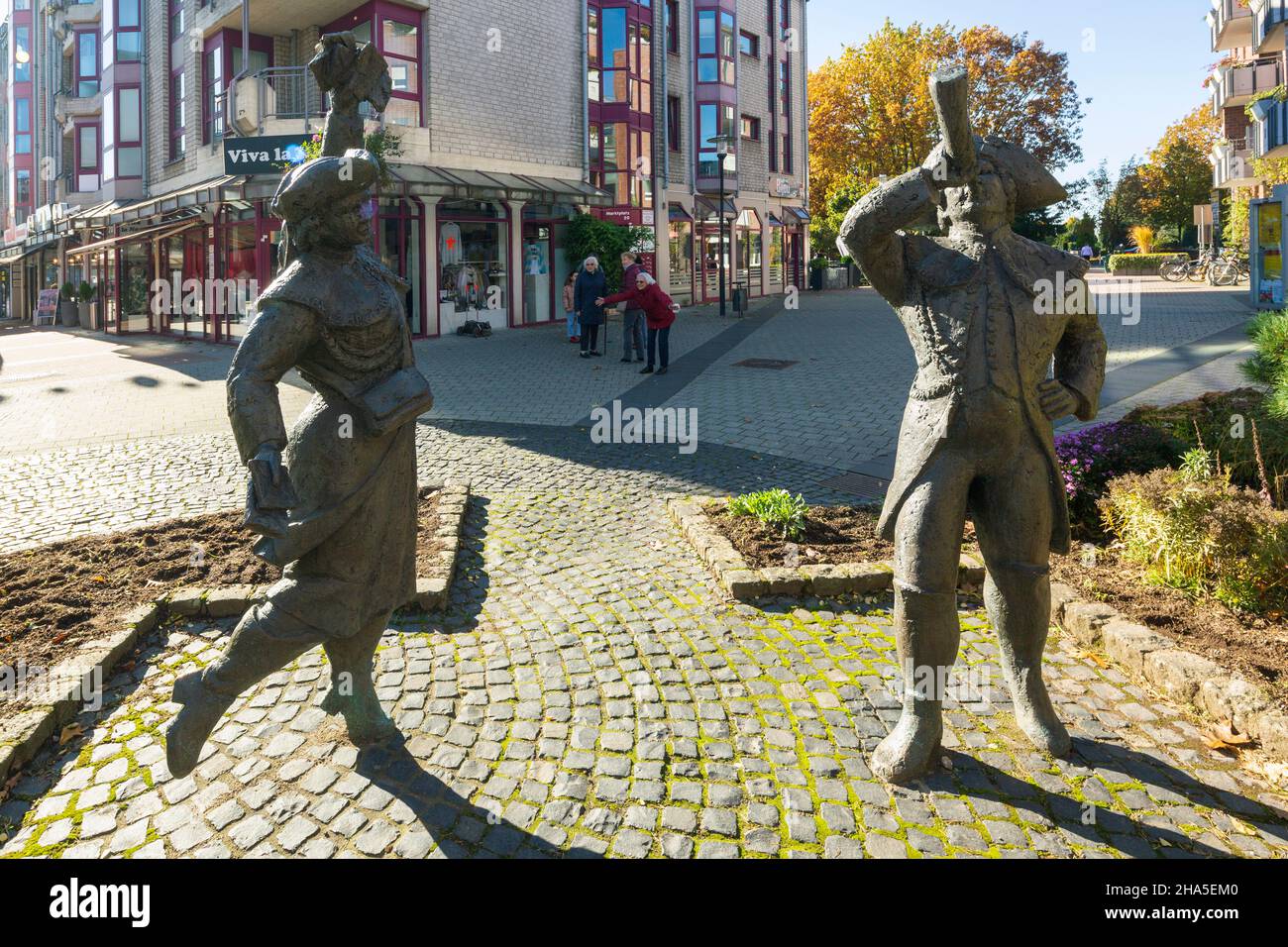 germany,langenfeld (rhineland),bergisches land,niederbergisches land,niederberg,rhineland,north rhine-westphalia,nrw,langenfeld-immigrath,bronze sculptures 'christel von der post and her postillion' by elke tenderich-veit in the pedestrian zone Stock Photo