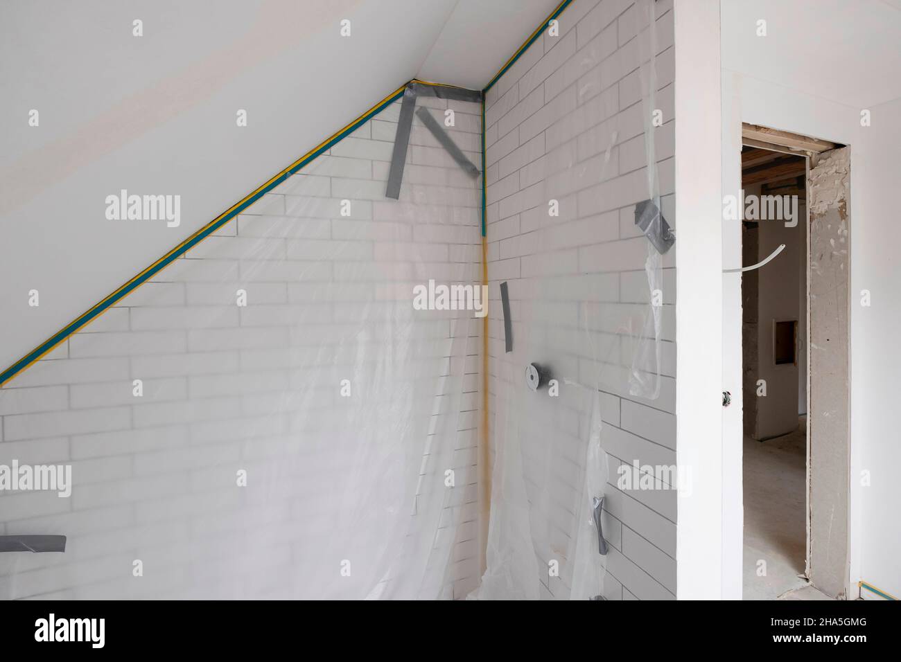 construction site,redevelopment and renovation of an apartment,empty room with foils Stock Photo