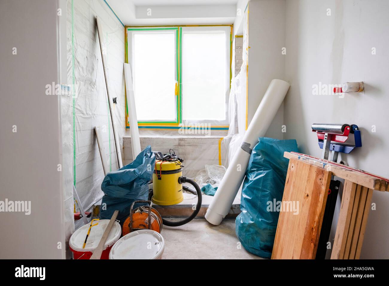 construction site,refurbishment and renovation of an apartment,tools and material storage in an empty room Stock Photo