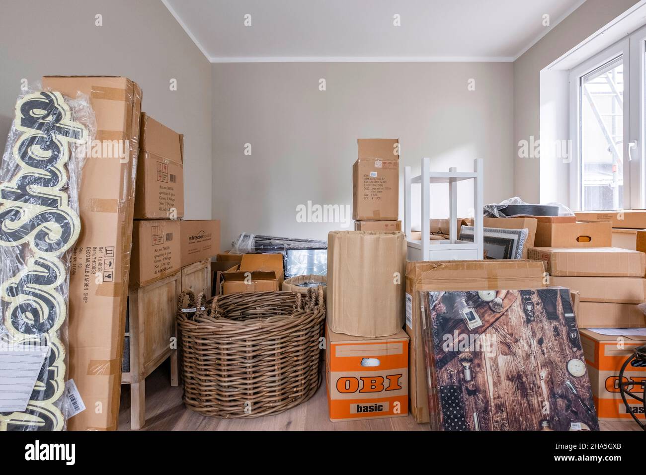 construction site,refurbishment and renovation of an apartment,lots of moving boxes and furniture when moving into the apartment Stock Photo