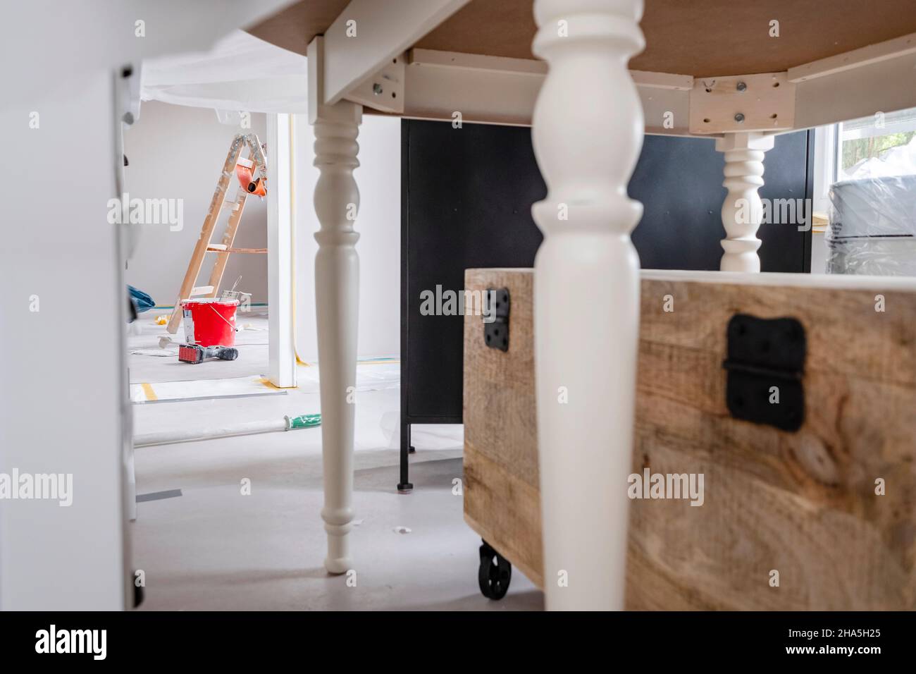construction site,refurbishment and renovation of an apartment,furniture in a room that is being painted Stock Photo