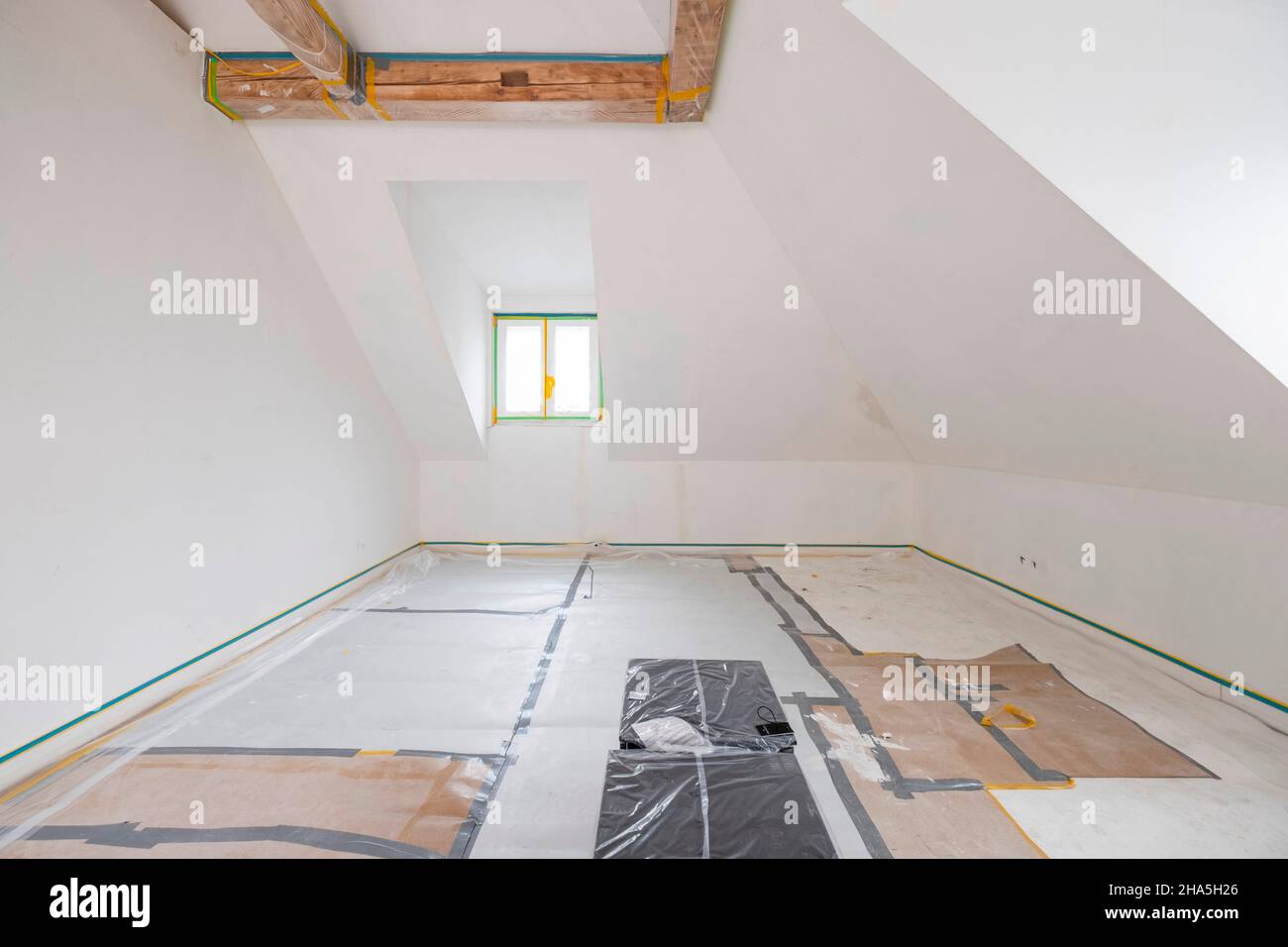 construction site,redevelopment and renovation of an apartment,empty room with covered floor Stock Photo