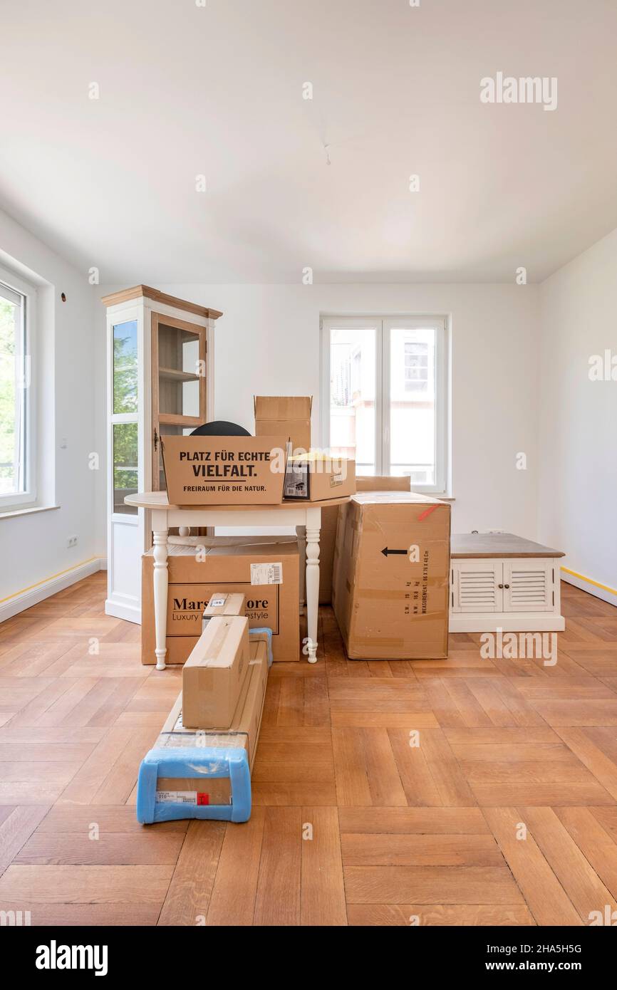 construction site,refurbishment and renovation of an apartment,boxes and furniture in a renovated room Stock Photo
