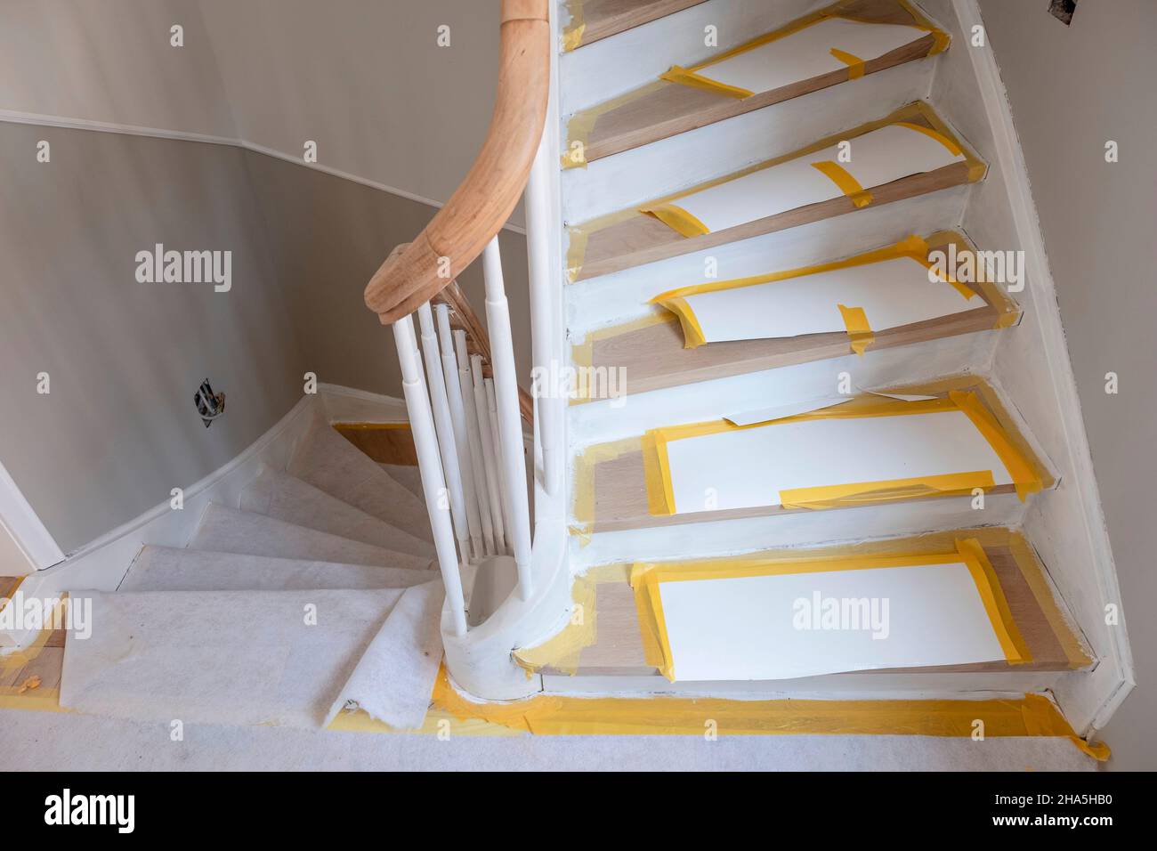 construction site,refurbishment and renovation of an apartment,covered steps in the stairwell of an old building Stock Photo