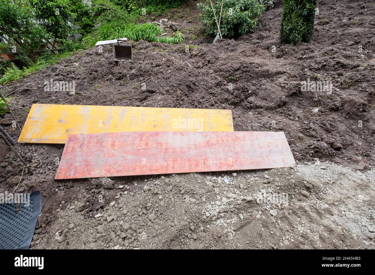 construction site,refurbishment and renovation of an apartment,formwork panels are in a dug garden Stock Photo