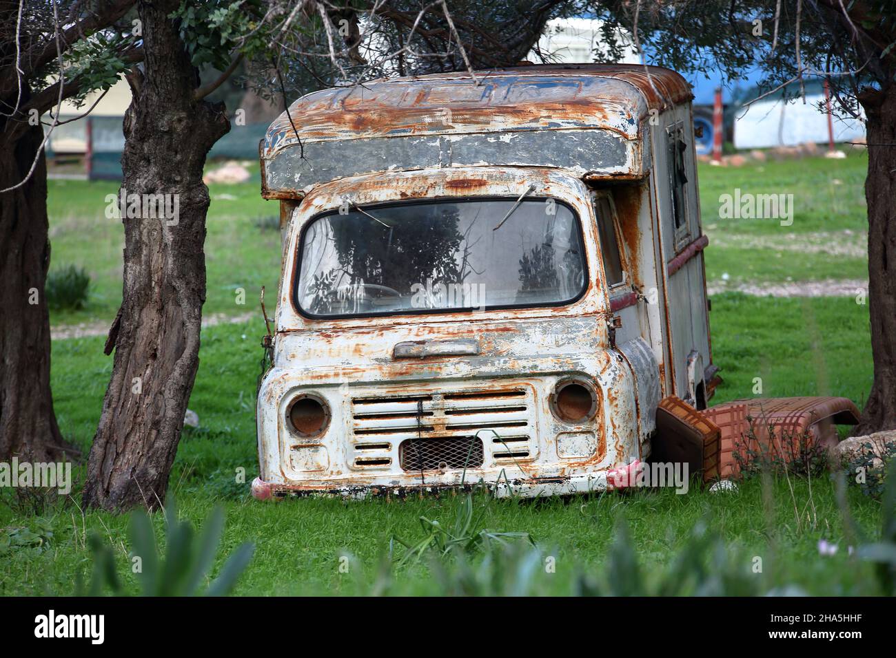 Old vintage rusty abandoned truck in forest Stock Photo