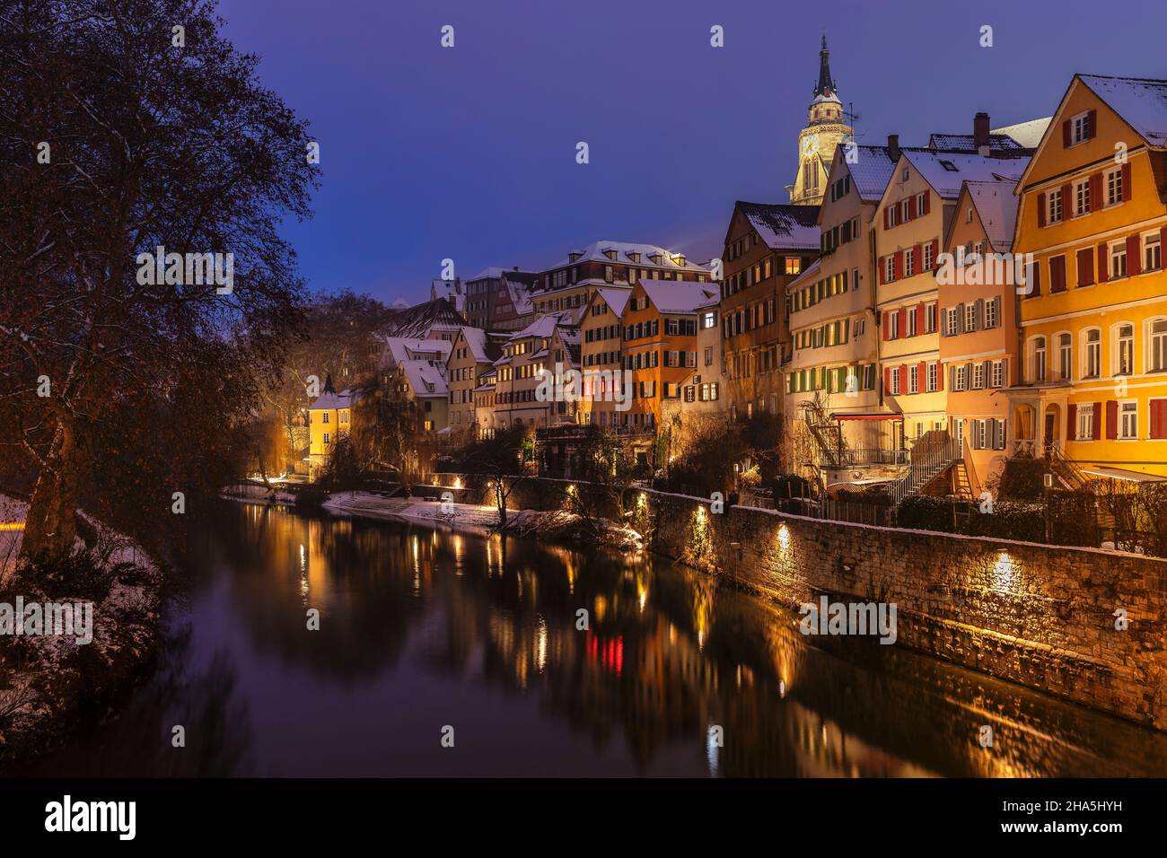 tuebingen old town with hoelderlin tower and collegiate church reflected in the neckar,tuebingen