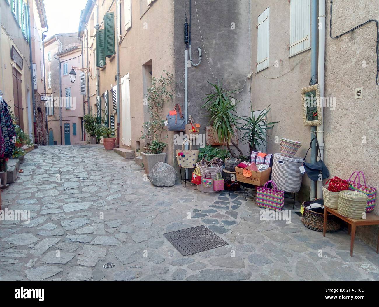 alley with boutique in a mountain village in southern france. Stock Photo