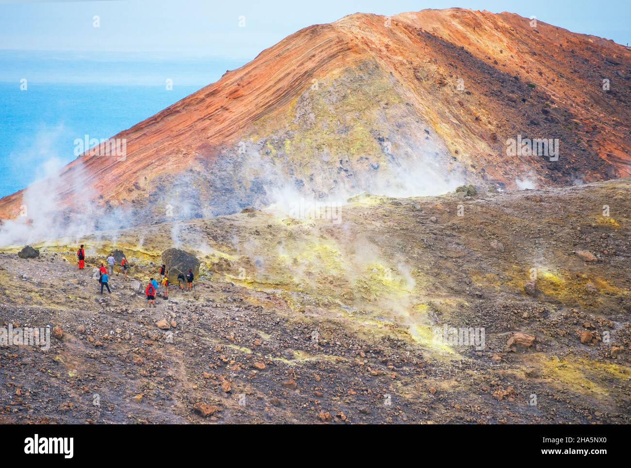 People walking on Gran Cratere, Vulcano Island, Aeolian Islands, Sicily, Italy Stock Photo