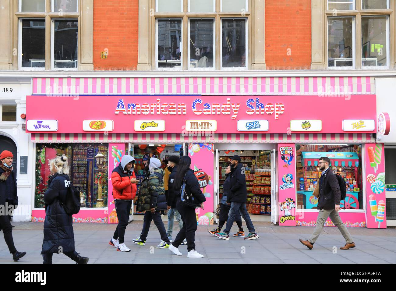 An abundance of unhealthy American candy stores have sprung up on Oxford Street replacing shops that have closed down during the coronavirus pandemic, 2021, in London, UK Stock Photo