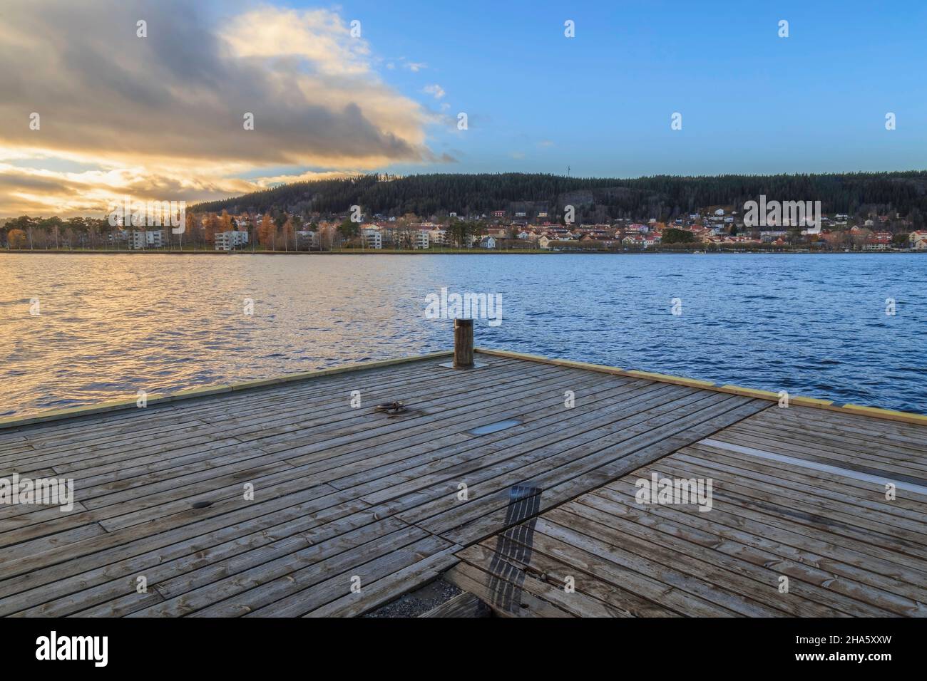 car track on a pier with city in back ground Stock Photo