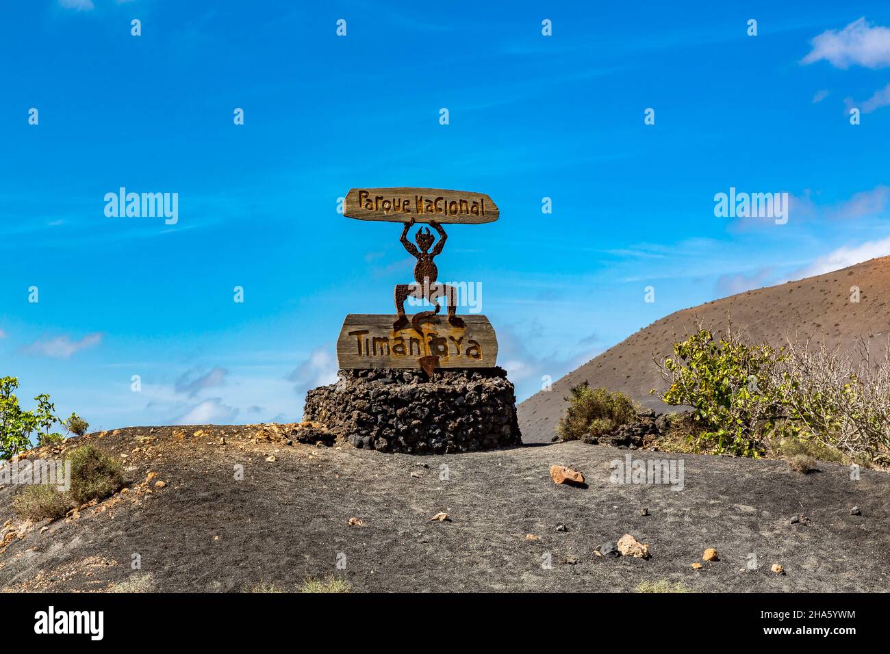 entrance sign,devil sculpture el diablo,logo designed by césar manrique,artist from lanzarote,timanfaya national park,parque nacional de timanfaya,montanas del fuego,lanzarote,canaries,canary islands,spain,europe Stock Photo