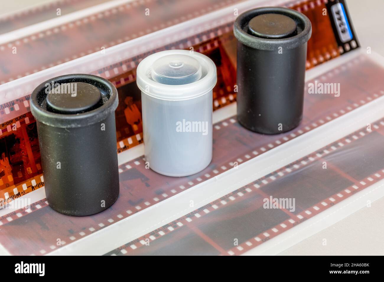 Plastic film canisters and film strips Stock Photo Alamy