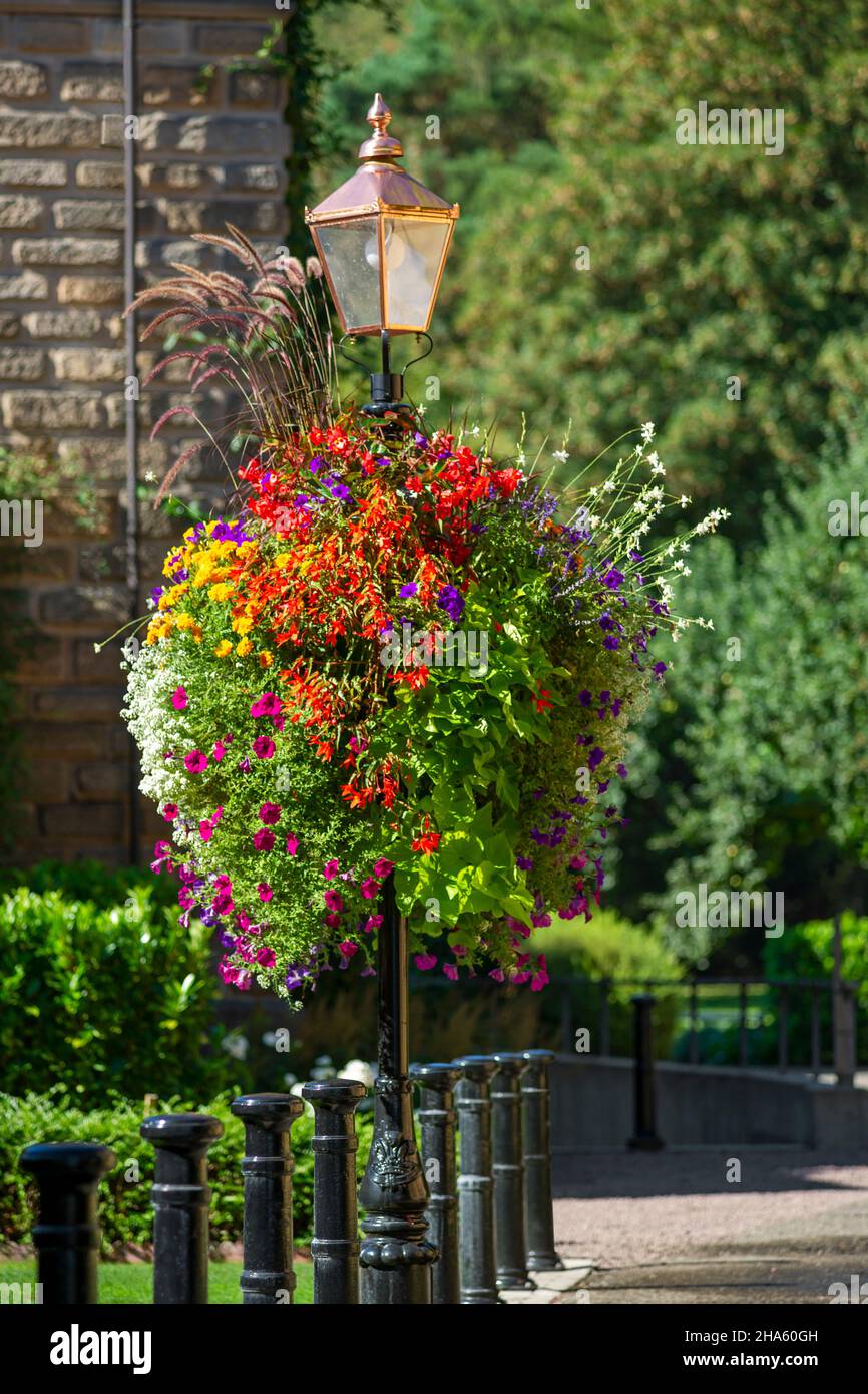 flower arrangements on a lantern on the grounds of the old weaving mill