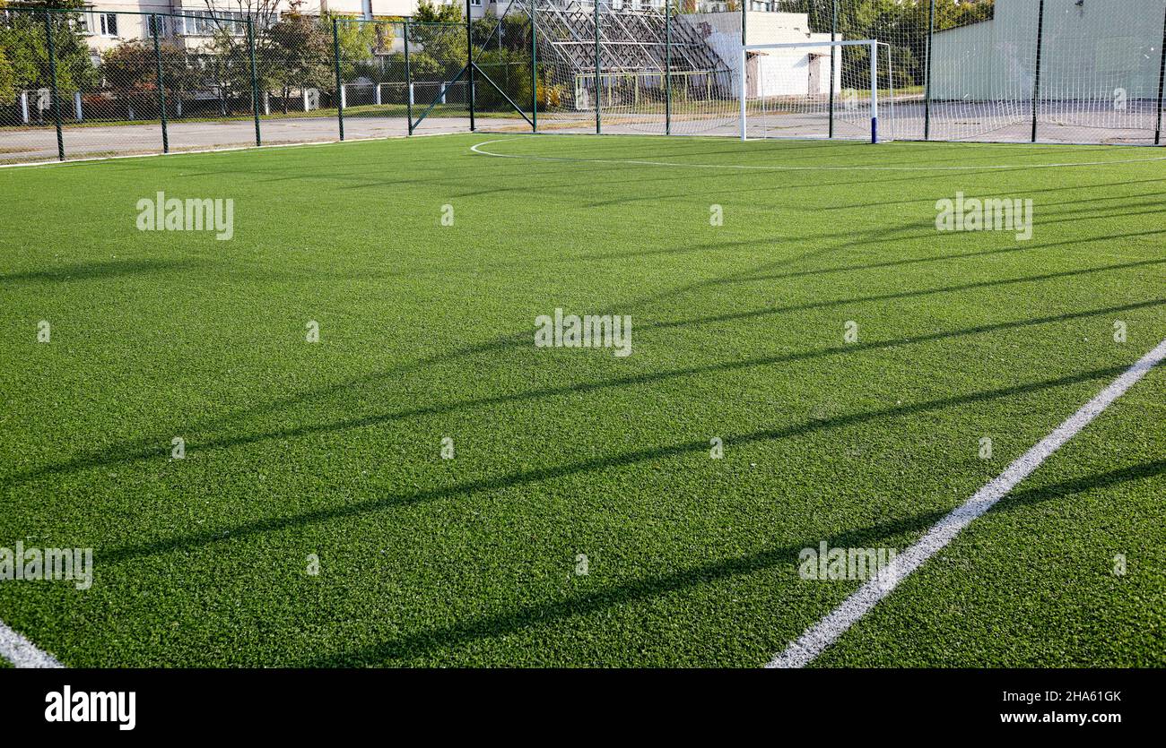 Lawn field for playing football. Closeup of soccer field with green