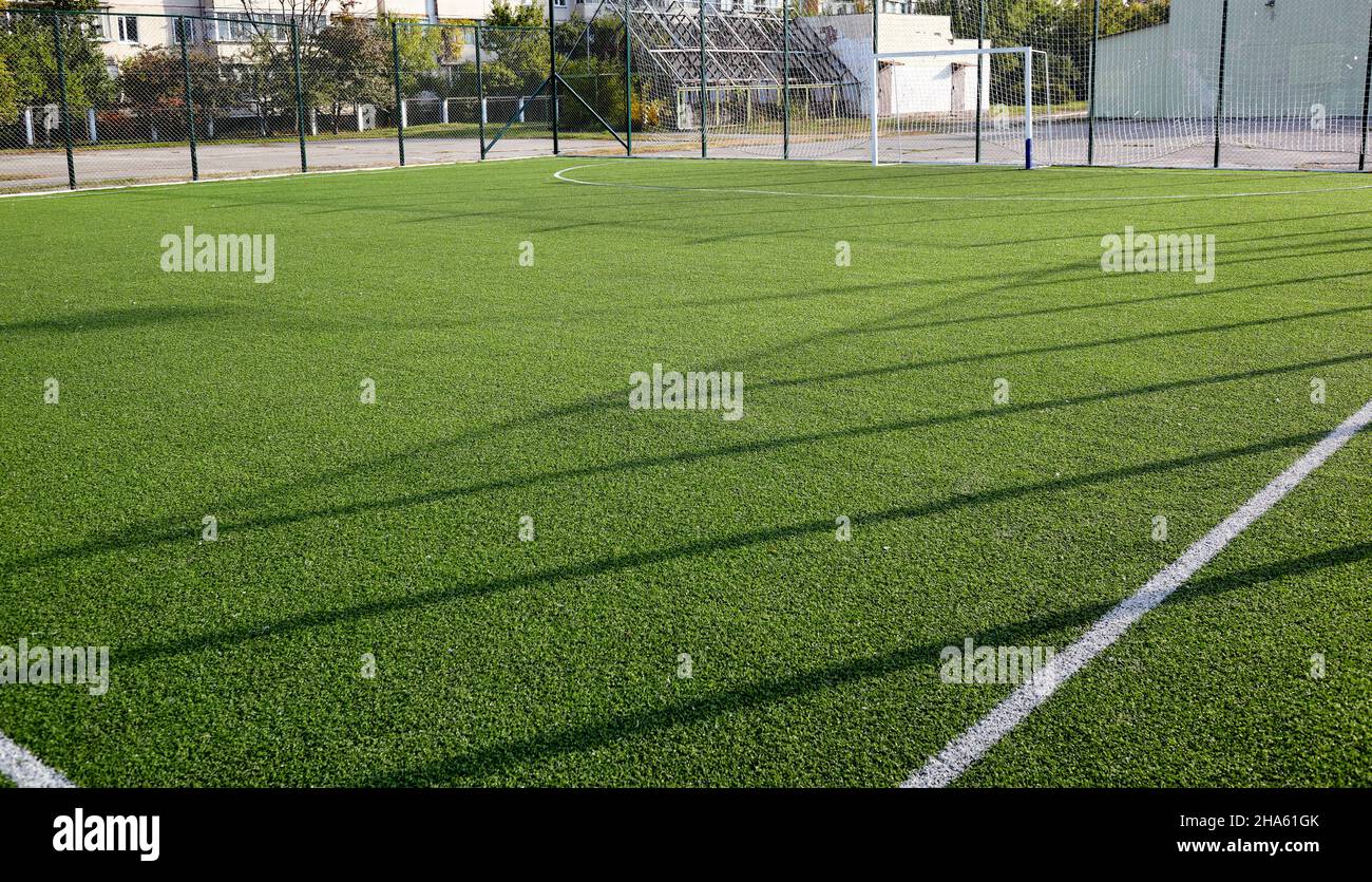 Lawn field for playing football. Close-up of soccer field with green grass Stock Photo