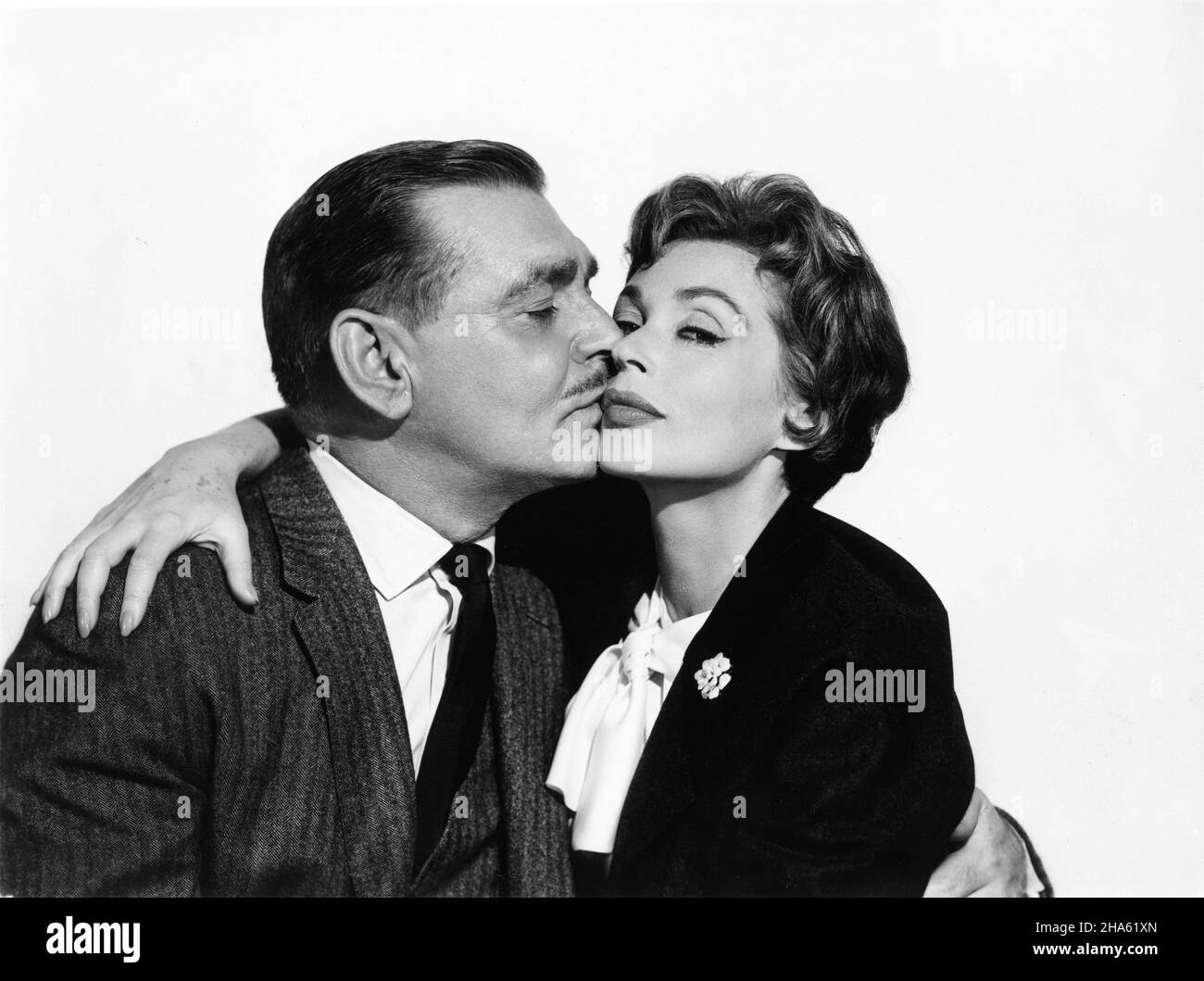 CLARK GABLE and LILLI PALMER Publicity Portrait in BUT NOT FOR ME 1959 director WALTER LANG from the play Accent On Youth by Samson Raphaelson screenplay John Michael Hayes costume design Edith Head Perlberg - Seaton Productions / Paramount Pictures Stock Photo