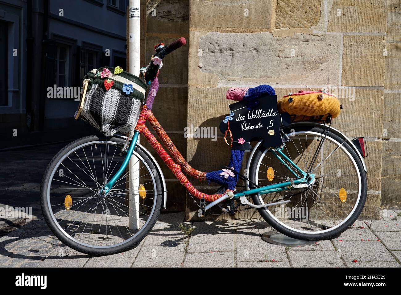 germany,bavaria,upper franconia,bamberg,old town,bicycle with knitted cover,advertisement for a wool shop Stock Photo