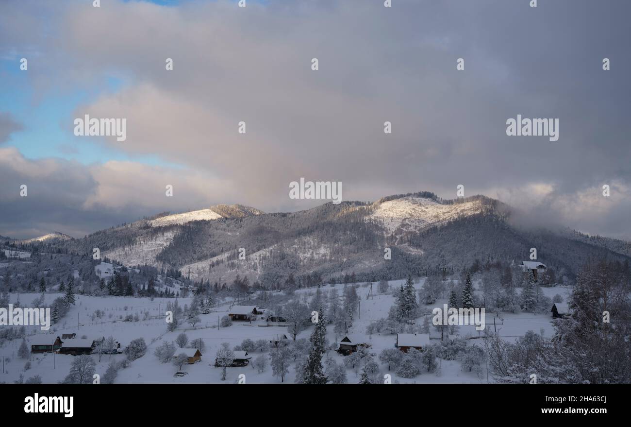 Snowy village on Carpathian mountains in Ukraine Stock Photo