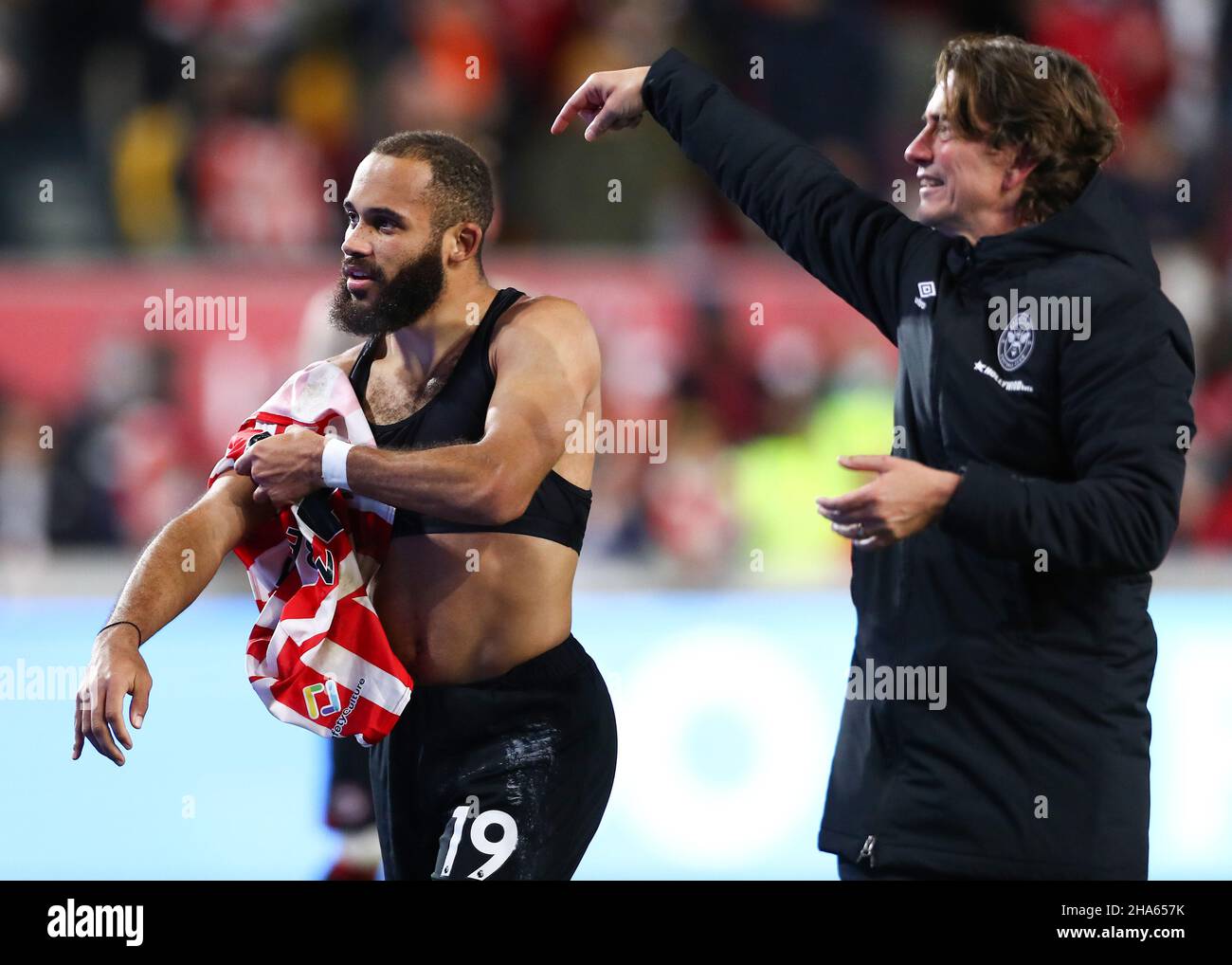 London, England, 10th December 2021.  Bryan Mbeumo of Brentford celebrates victory with Thomas Frank, Manager of Brentford following the Premier League match at Brentford Community Stadium, London. Picture credit should read: Jacques Feeney / Sportimage Credit: Sportimage/Alamy Live News Stock Photo