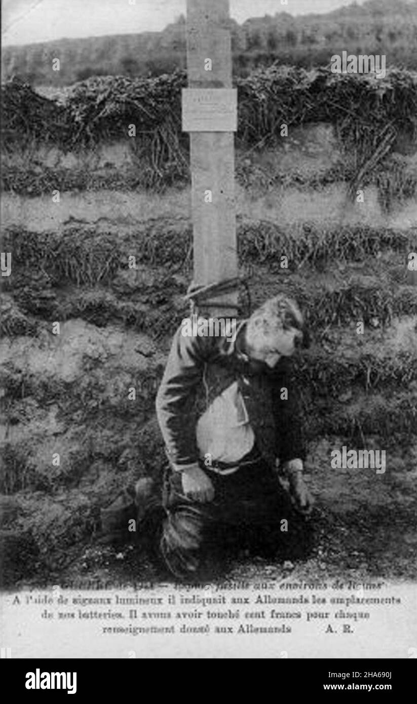 postcard featuring teh Execution of a German Spy during World War 1. This man was captured in France, near Reims while he was signalling the French positions to the Germans with a light. He confessed that he was paid 100 French francs for each piece of information he gave to the Germans. Stock Photo