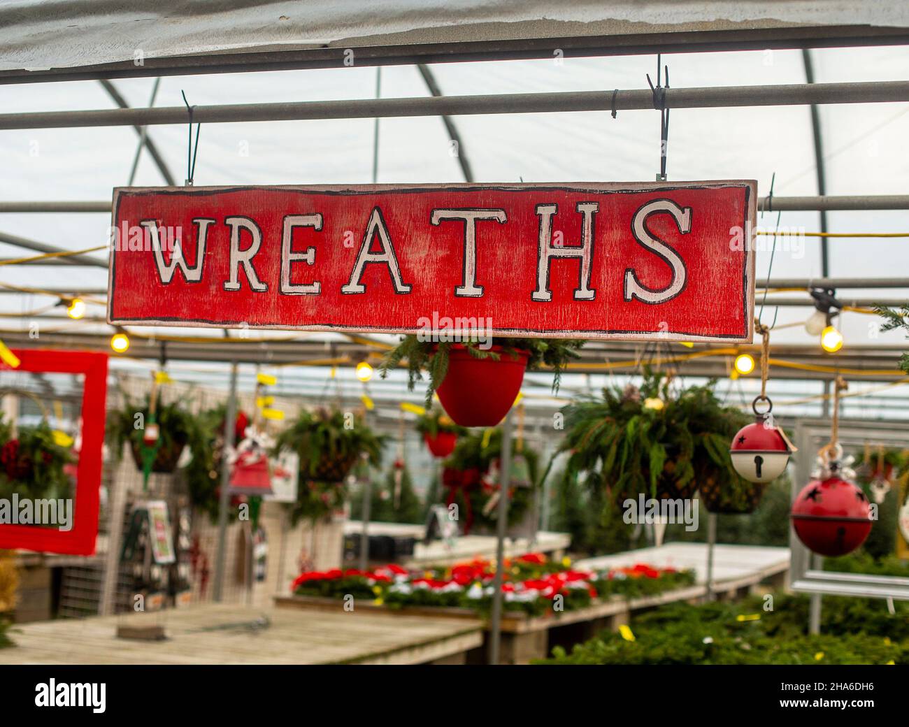A wreath sign at a nursery selling Christmas decorations Stock Photo