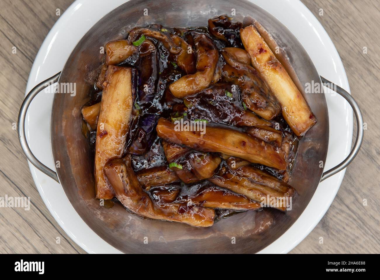 Overhead view of vegetarian style meal with flavored eggplant in szechwan sauce Stock Photo