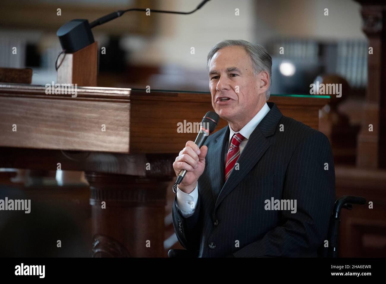Austin Texas USA, Dec. 10 2021: Texas Gov. Greg Abbott speaks at an investiture ceremony for new Texas Supreme Court Justice Rebecca A. Huddle at the Texas Capitol. Huddle has been on the court for a year but her formal swearing-in ceremony was delayed due to COVID protocols. Credit: Bob Daemmrich/Alamy Live News Stock Photo