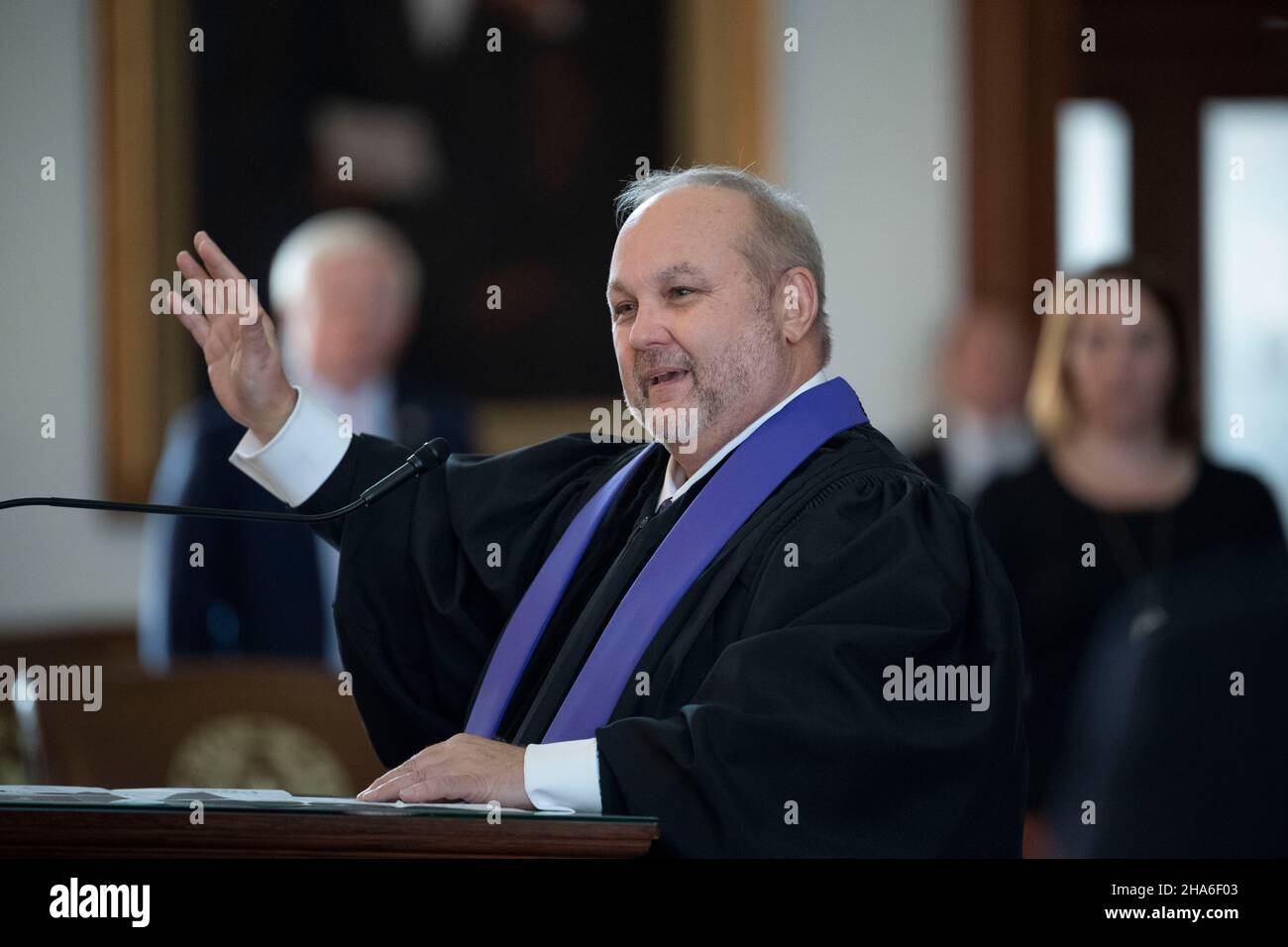 Austin Texas USA, Dec. 10 2021: Presbyterian pastor Gregory Davidson speaks at an investiture ceremony for new Texas Supreme Court Justice Rebecca A. Huddle at the Texas Capitol. Huddle has been on the court for a year but her formal swearing-in ceremony was delayed due to COVID protocols. Credit: Bob Daemmrich/Alamy Live News Stock Photo