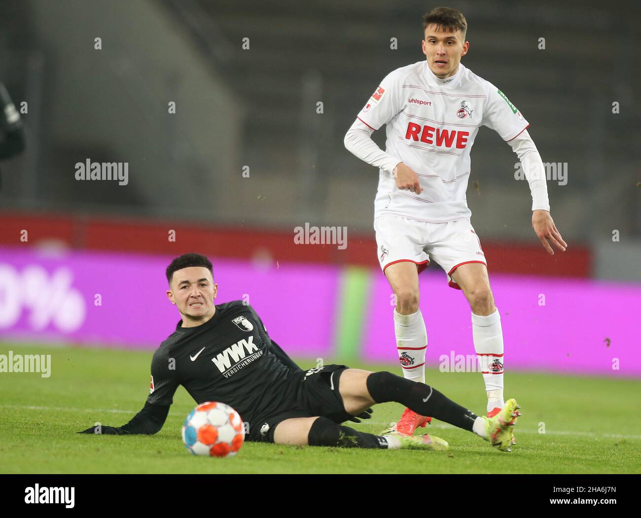 Koeln, Germany. 10th Dec, 2021. Dejan Ljubicic of Koeln, (R) and Ruben Vargas (L) of FC Augsburg are seen in action during the Bundesliga soccer match between Augsburg Vs FC Koeln at the RheinEnergie Stadium in Koeln( Final score; Augsburg 2:0 FC Koeln) Credit: SOPA Images Limited/Alamy Live News Stock Photo