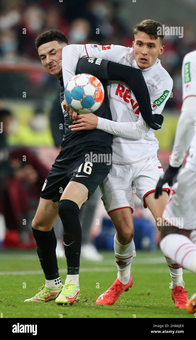 Koeln, Germany. 10th Dec, 2021. Dejan Ljubicic of Koeln, (R) and Ruben Vargas (L) of FC Augsburg are seen in action during the Bundesliga soccer match between Augsburg Vs FC Koeln at the RheinEnergie Stadium in Koeln( Final score; Augsburg 2:0 FC Koeln) (Photo by Osama Faisal/SOPA Images/Sipa USA) Credit: Sipa USA/Alamy Live News Stock Photo