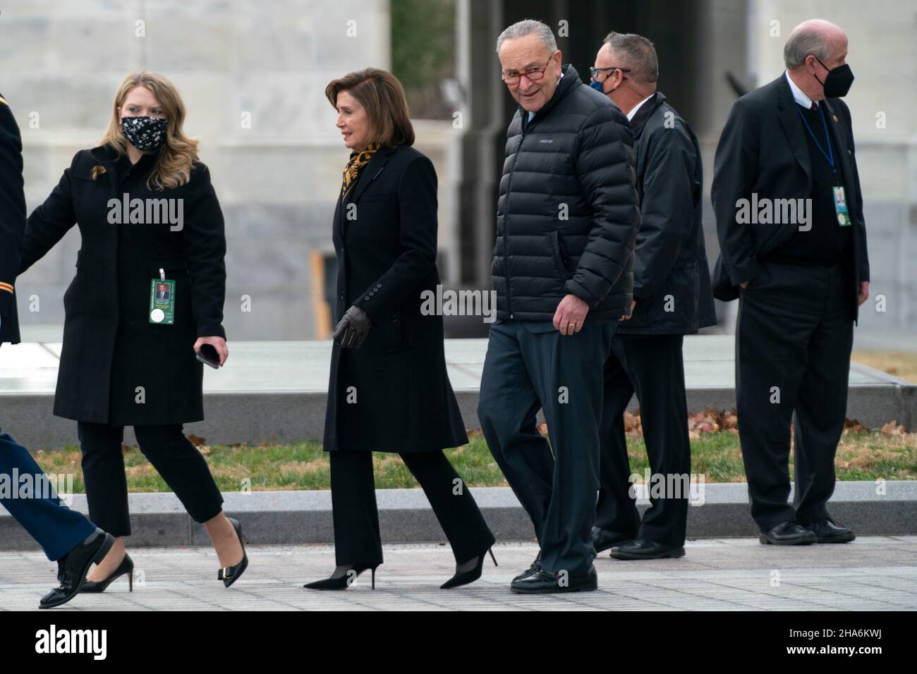 Washington, DC. 10th Dec, 2021. Speaker Nancy Pelosi (D-Calif.) and Majority Leader Charles Schumer (D-N.Y.) are seen before a military honor guard carries the casket of Sen. Bob Dole (R-Kan.) after lying in state at the U.S. Capitol in Washington, DC, on Friday, December 10, 2021. Dole will be taken to Washington National Cathedral for a funeral service. Credit: Greg Nash/Pool via CNP/dpa/Alamy Live News Stock Photo