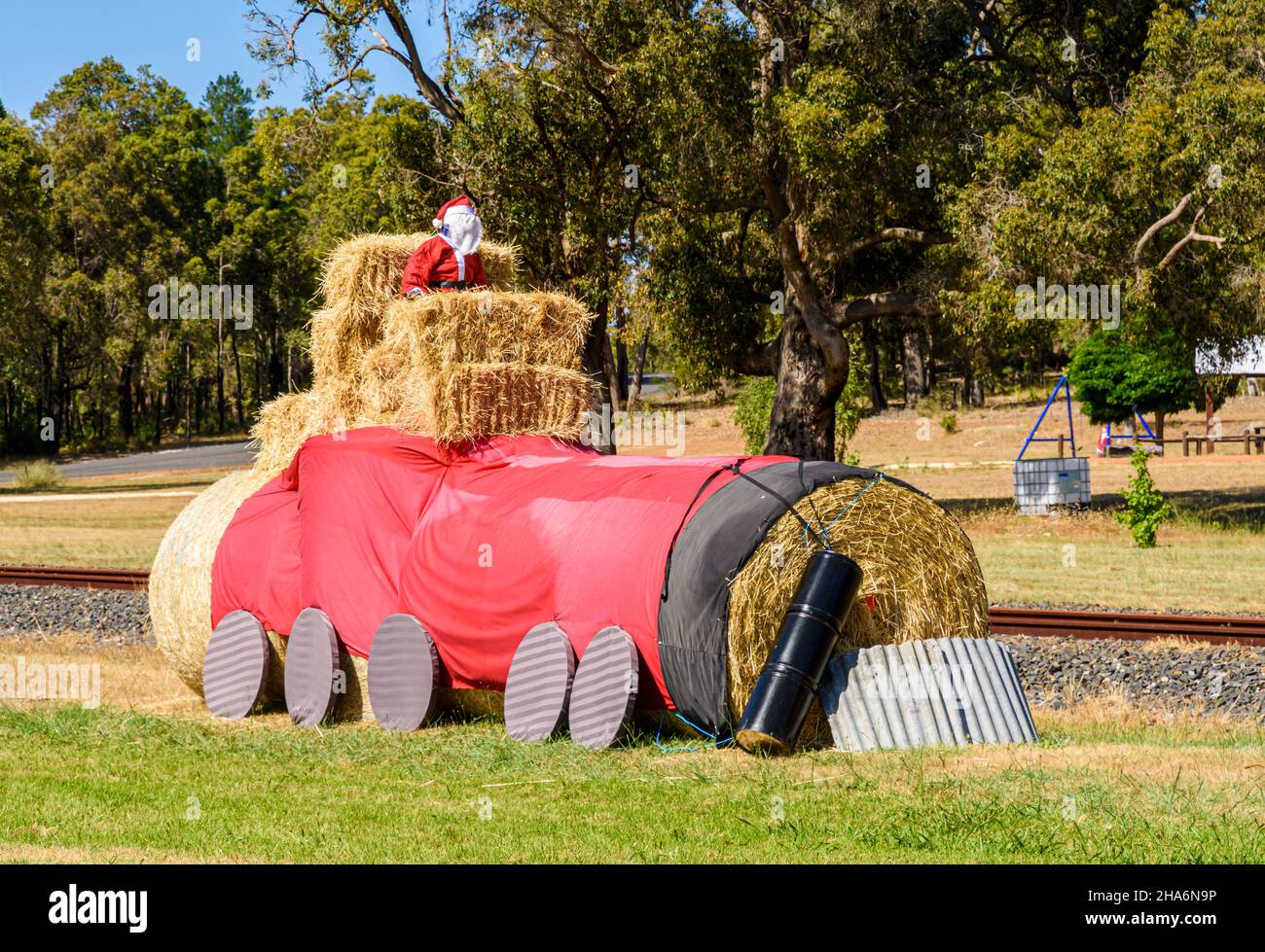 Christmas decorations of Father Christmas in various settings line the road through the rural country town of Kirup, Western Australia, Australia Stock Photo