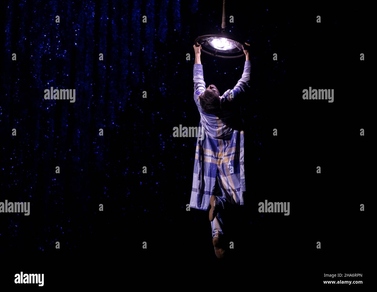 New York, NY - December 9, 2021: Alexis Vigneault performs Aerial Lamp act during media dress rehearsal for ‘TWAS THE NIGHT BEFORE... by Cirque du Soleil at MSG Hulu Theater Stock Photo