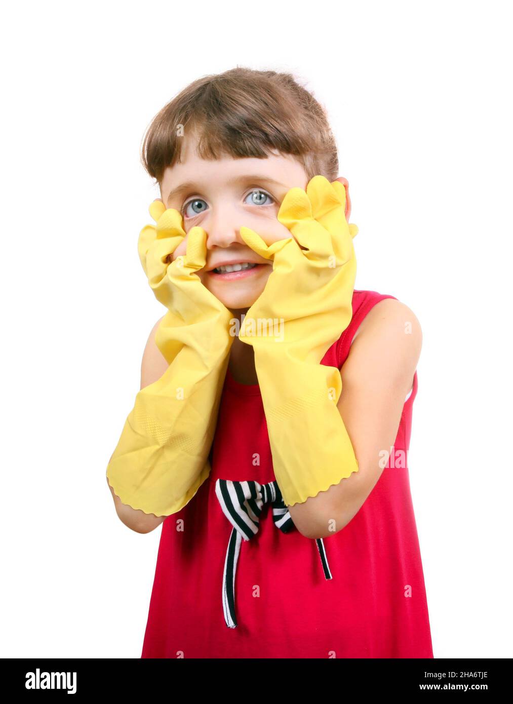 Little Girl in Rubber Gloves make a Funny Face on the White Background Stock Photo