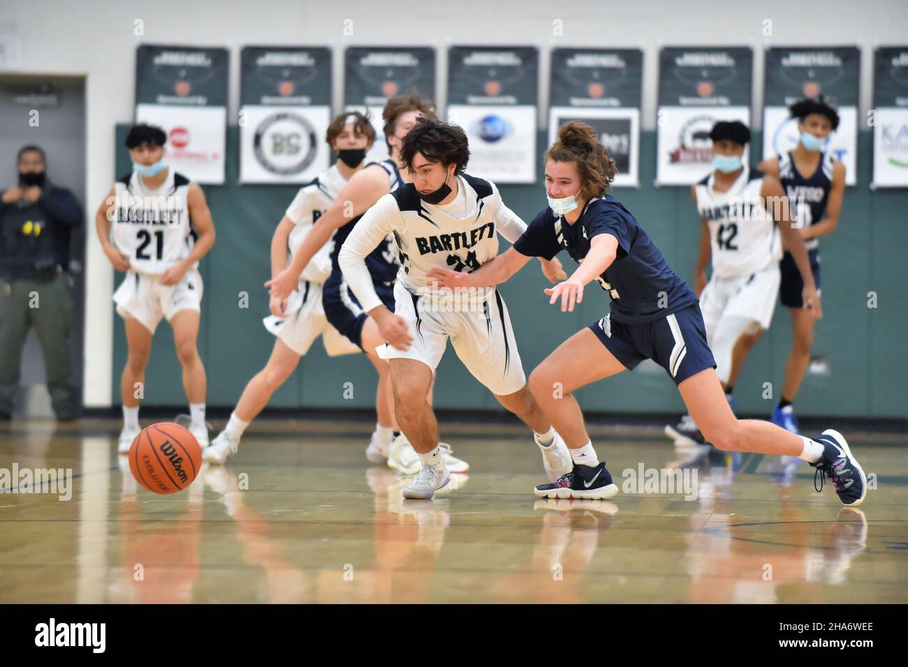 USA. Players pursue a loose ball after turnover at the opposite end of the court. Stock Photo