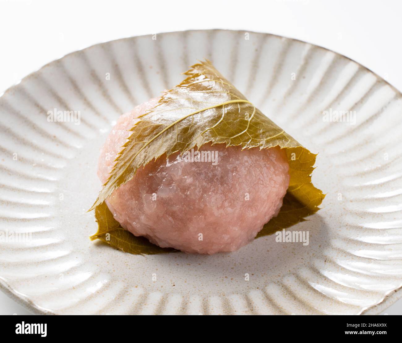 rice cake with bean paste wrapped in a preserved cherry leaf.Japanese ...