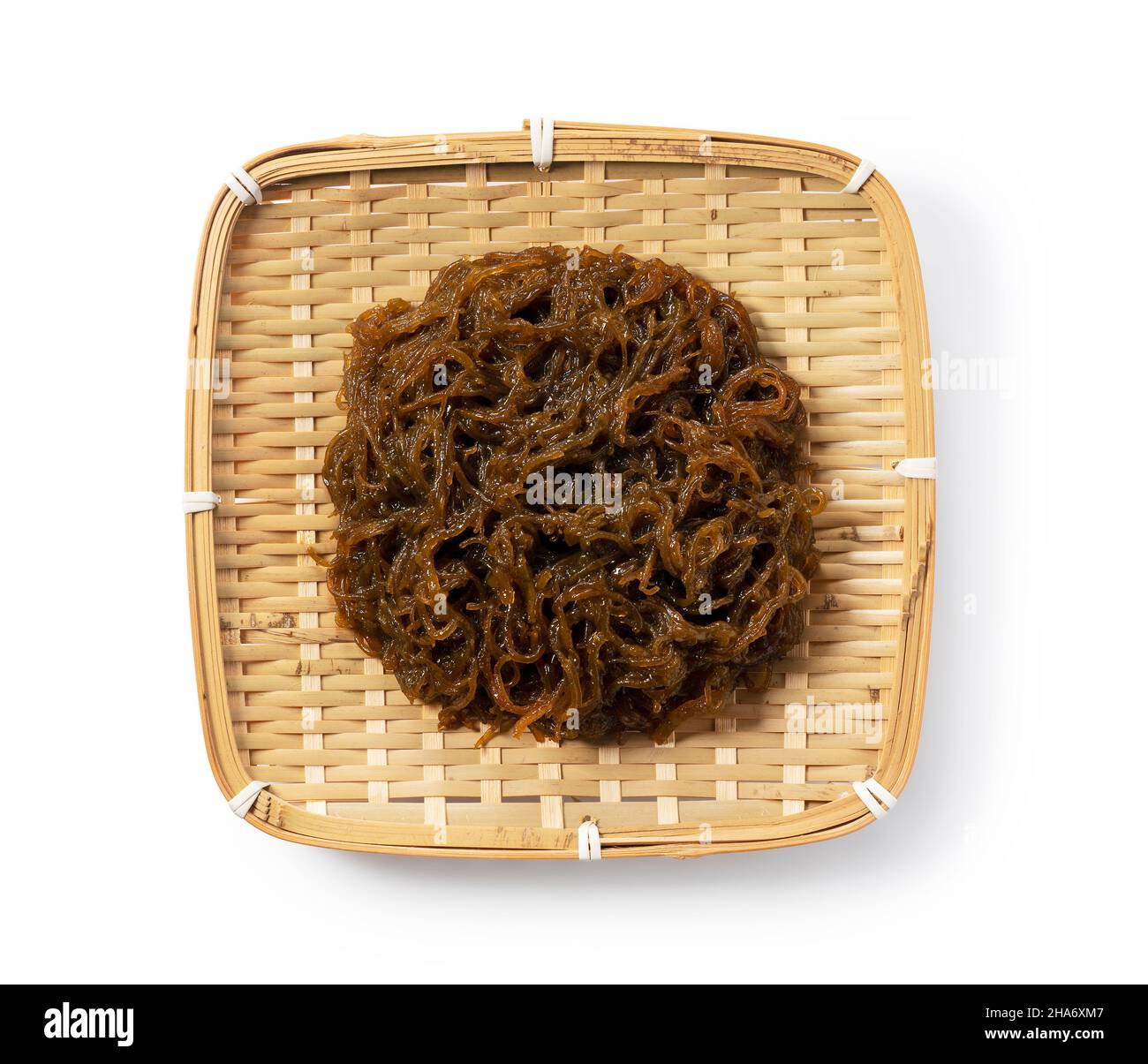 Mozuku in a colander on a white background.Mozuku is an Okinawan