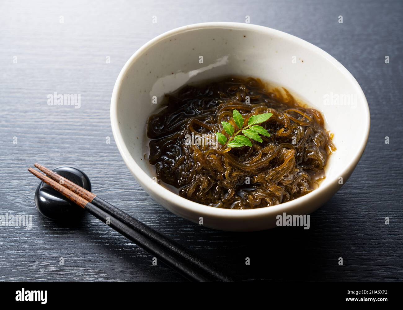 A mozuku seaweed placed on a black background.Mozuku is an Okinawan