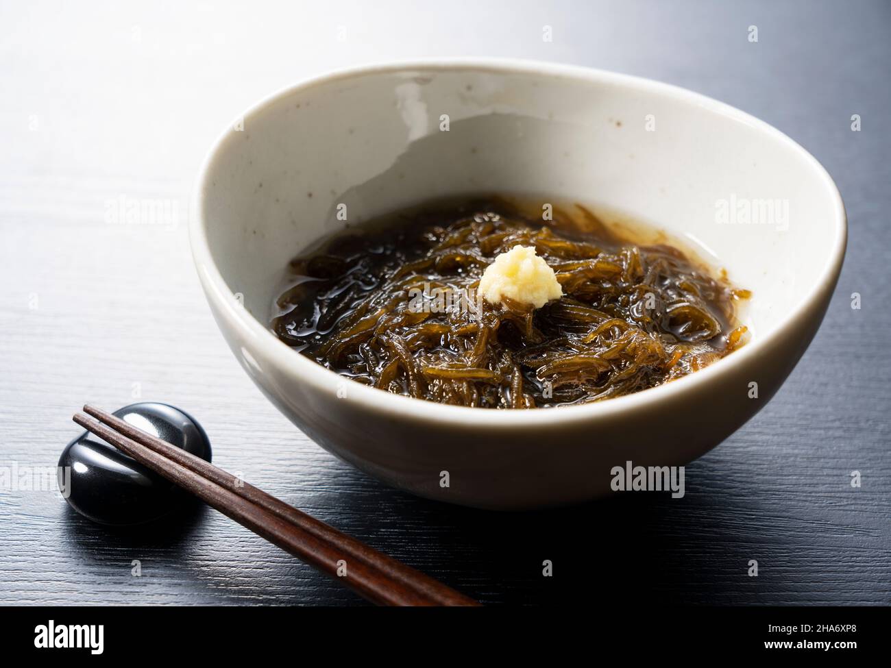 A mozuku seaweed placed on a black background.Mozuku is an Okinawan