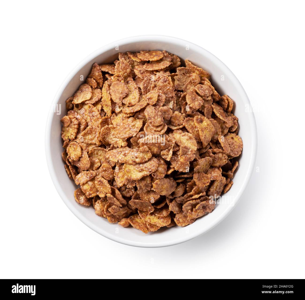Chocolate cornflakes in a white ceramic bowl. View from directly above. Stock Photo