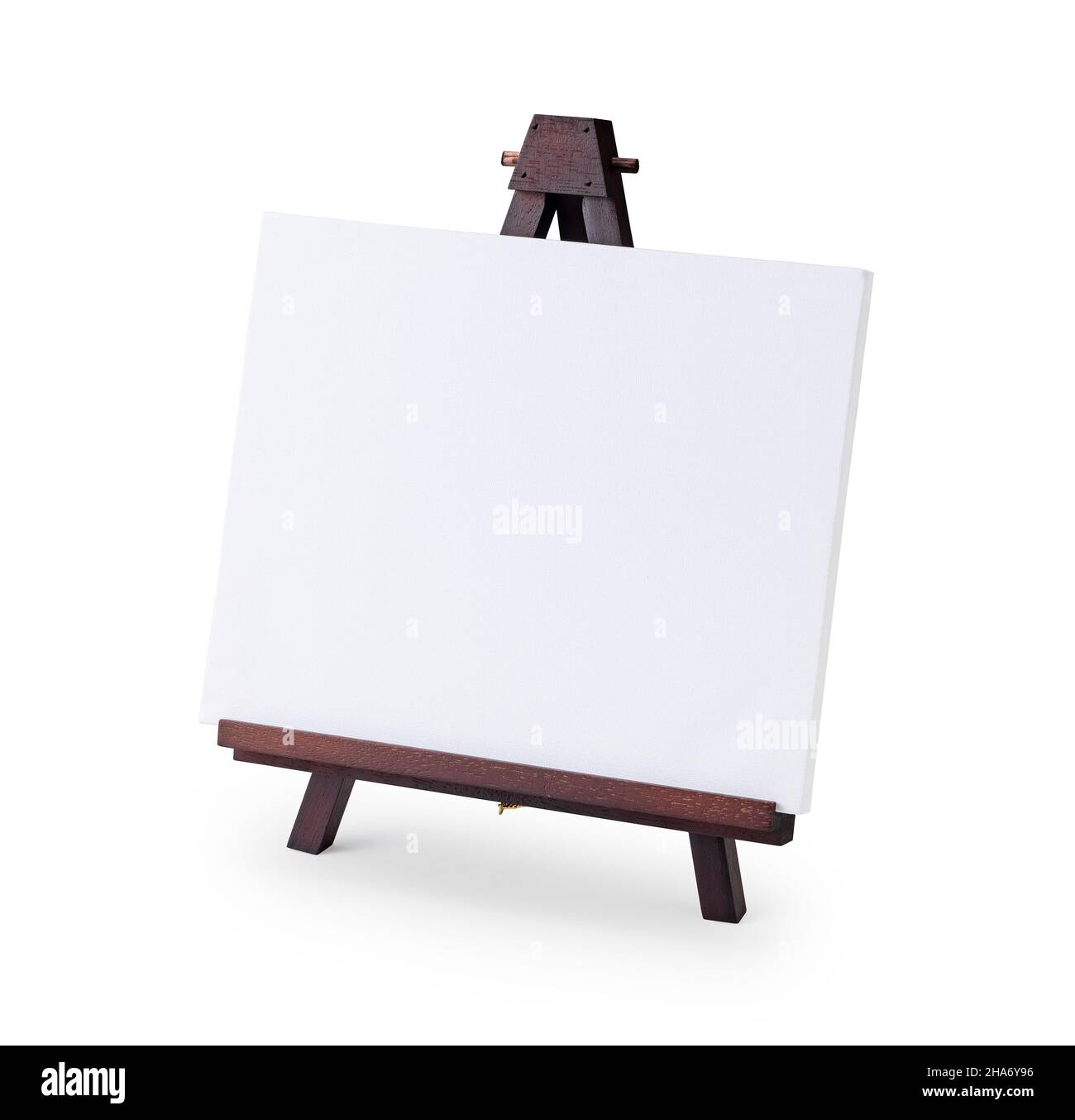 White mini canvas on a small dark brown wooden easel stand Stock Photo